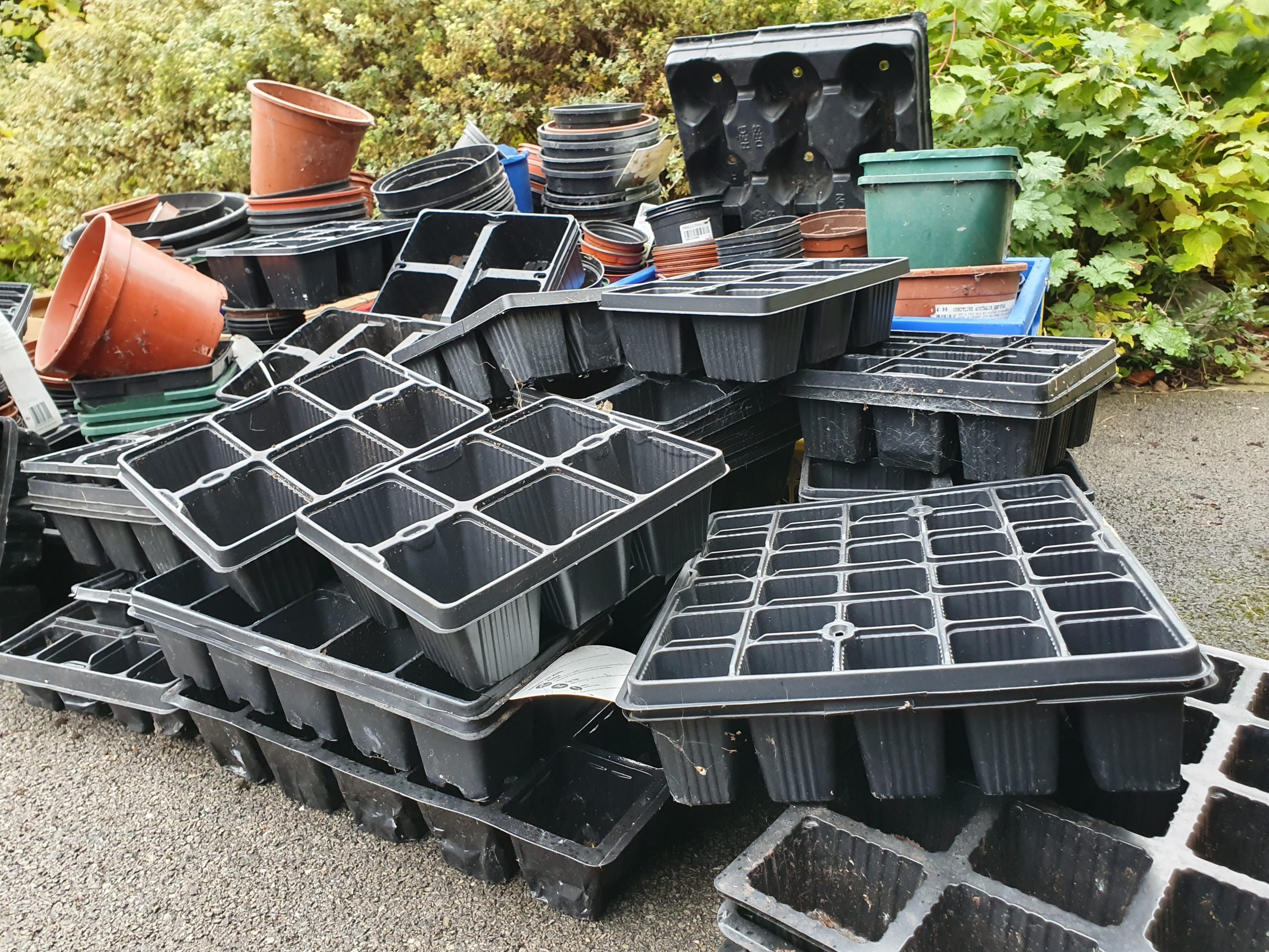 pile of plastic plant pots